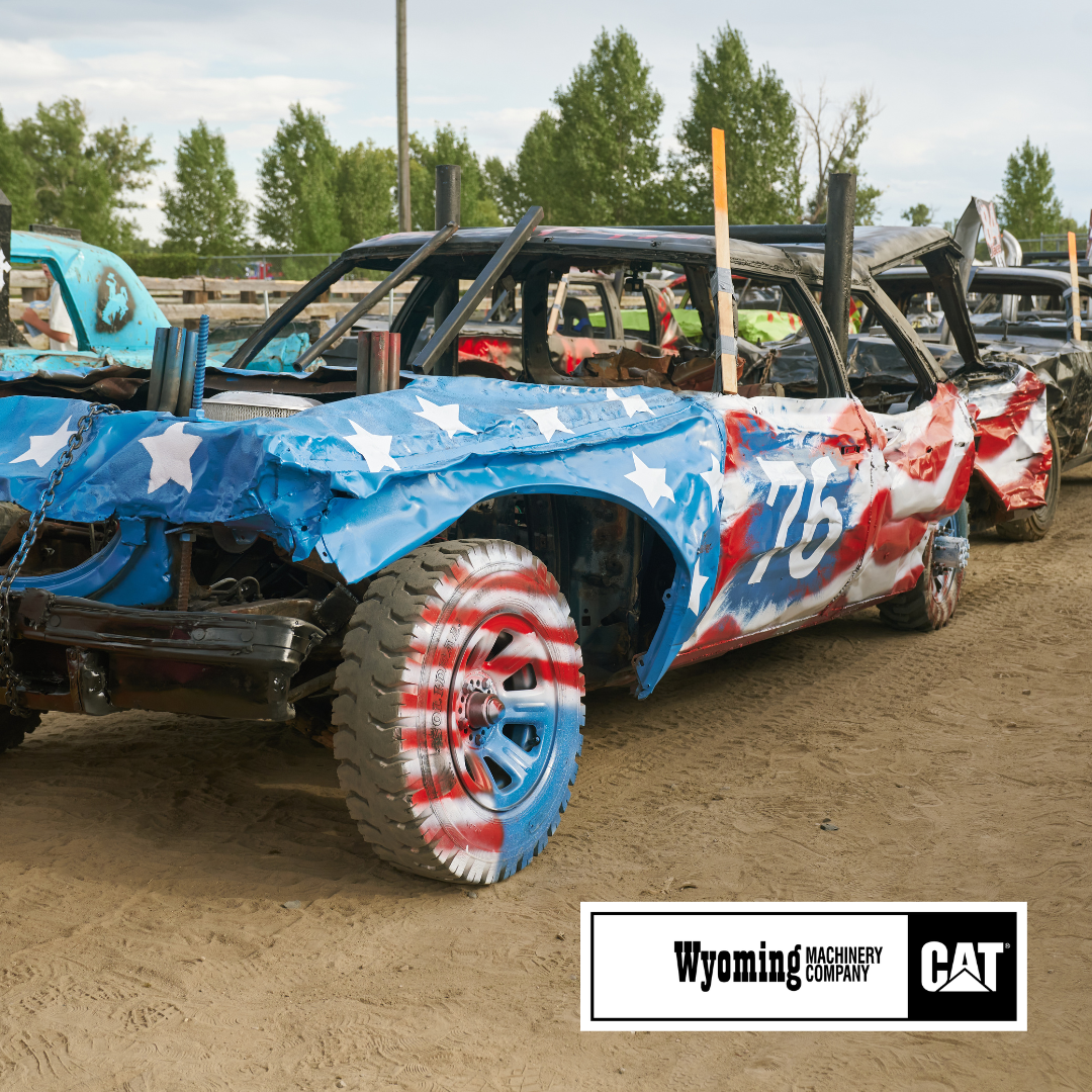 Sponsored Patriotic Derby Car Patriotically painted demolition derby cars lined up on the dirt arena at the Wyoming State Fair.